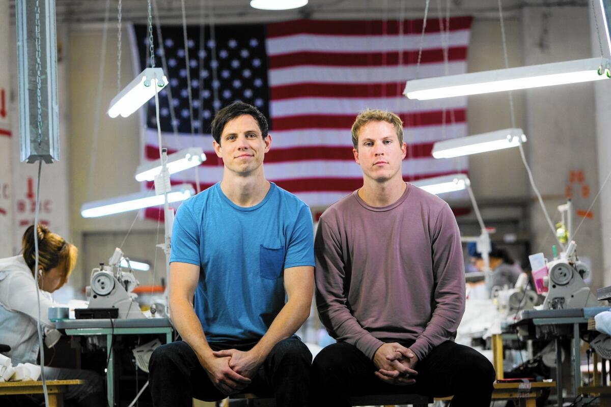 Matt Boelk, left, and Rob Lohman are owners of Groceries Apparel. He'd be happy to pay $15 an hour if and when they're doing well enough, Lohman said.