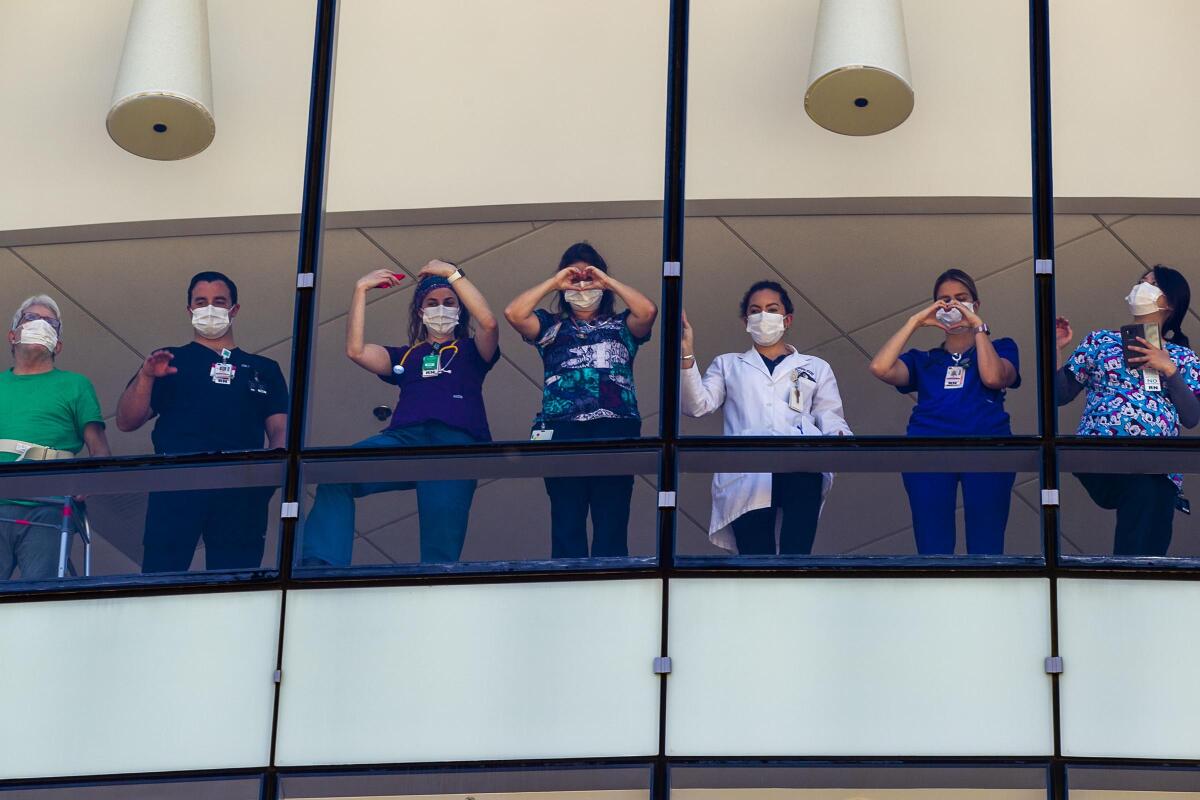 Sharp Memorial Hospital workers and patients watch a flyover salute in San Diego. 