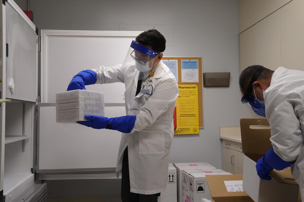 David Cheng stores trays of the Pfizer-BioNTech COVID-19 vaccine at Kaiser Permanente Los Angeles Medical Center.