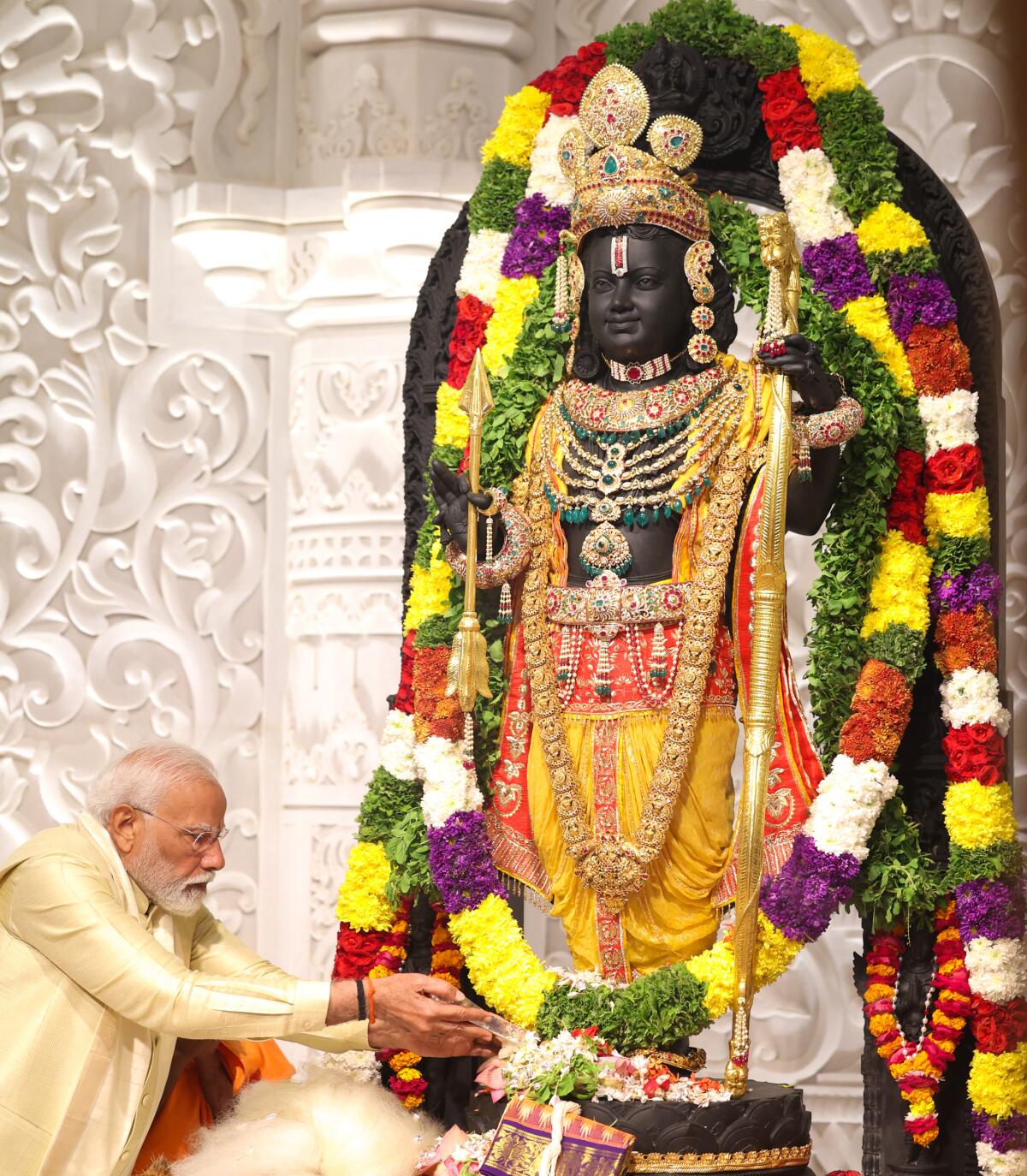 Narendra Modi and flower-bedecked Ram idol 