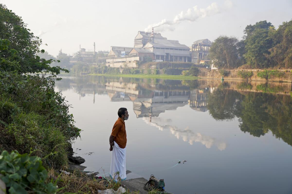 Adam Kutty stands on the bank of the Periyar River