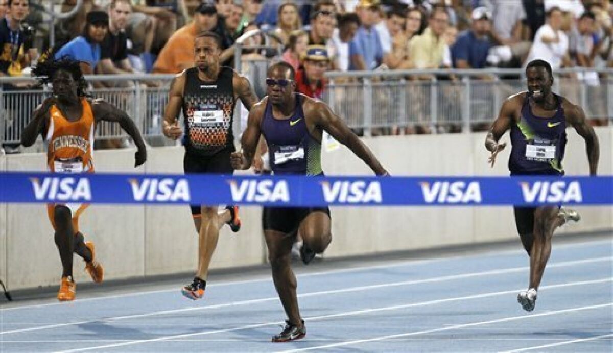 Team Nike's Walter Dix, center, wins the men's 100 meter dash at the USA Outdoor Track and Field Championships, Friday, June 25, 2010, in Des Moines, Iowa. Finishing behind Dix are Evander Wells, left, Wallace Spearmon and Leroy Dixon, right. (AP Photo/Charlie Neibergall)