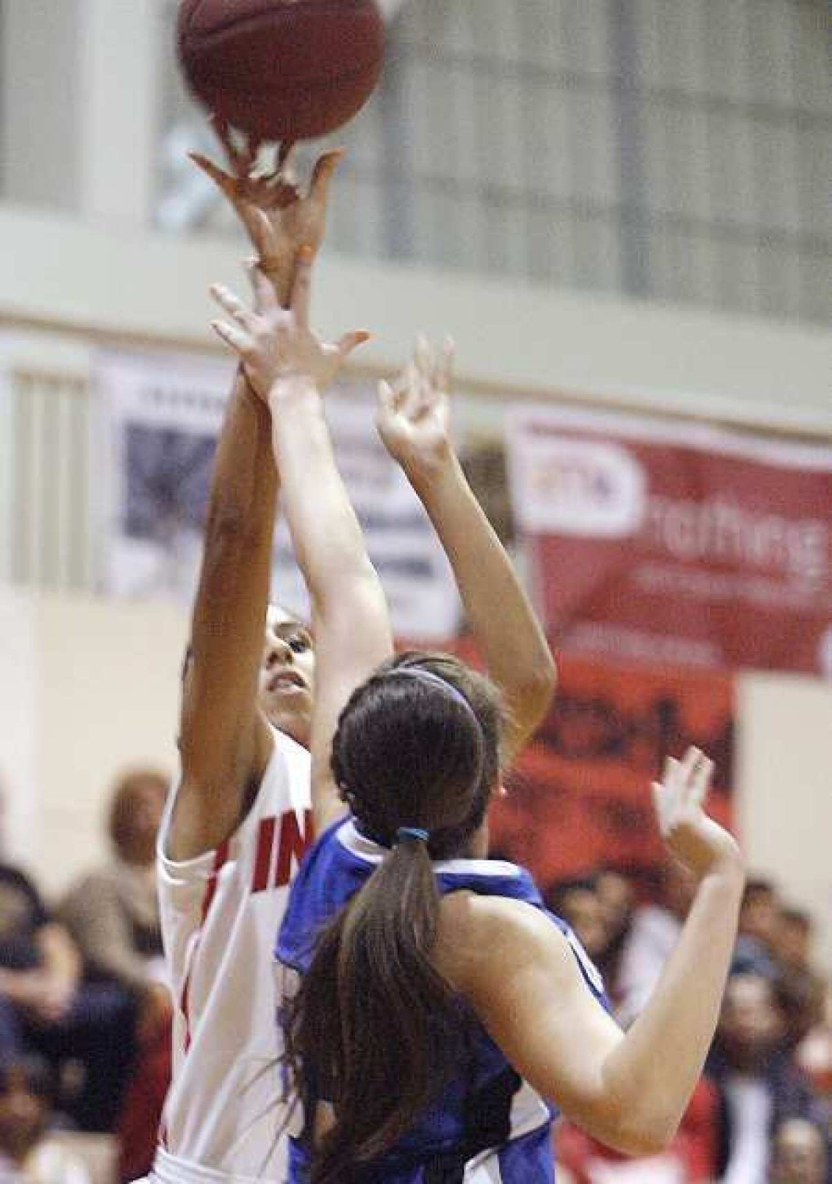 Burroughs senior center Aysia Shellmire led the Indians with 19 points and nine rebounds.