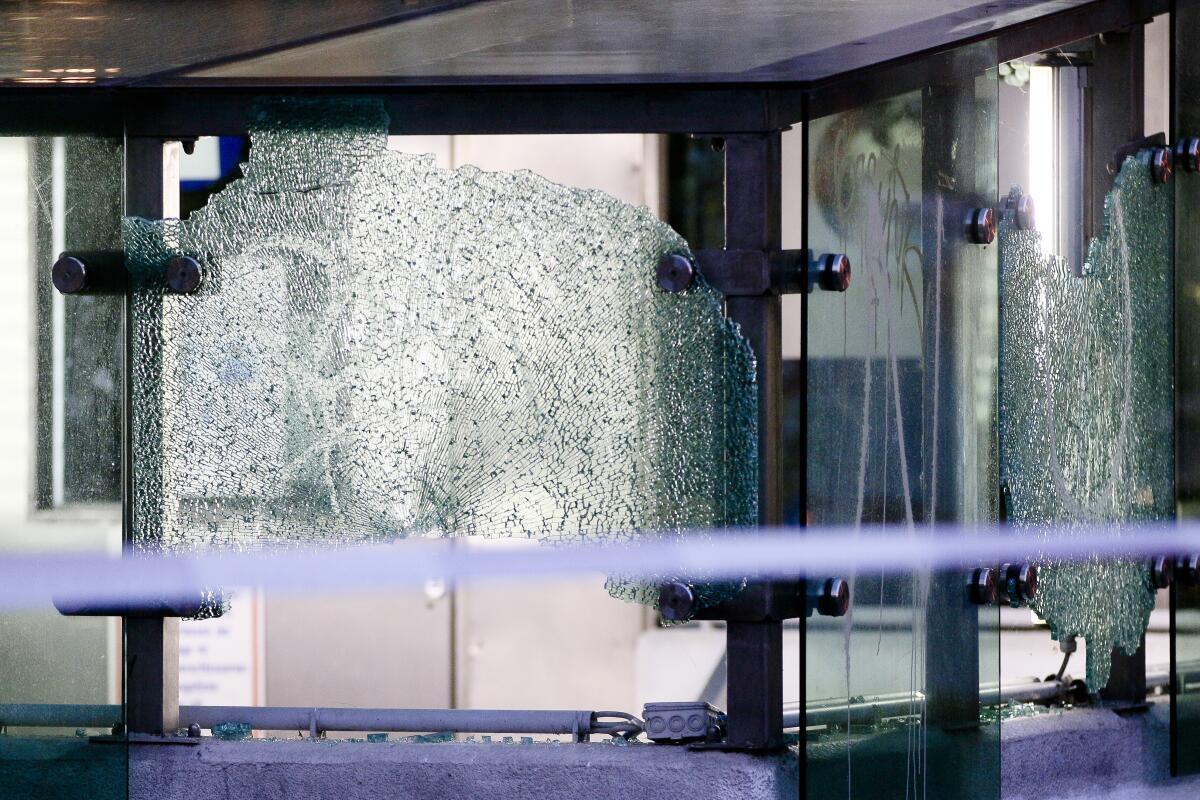 Shivered glass at the entrance of a parking lot at the scene of a gun attack in Vienna.