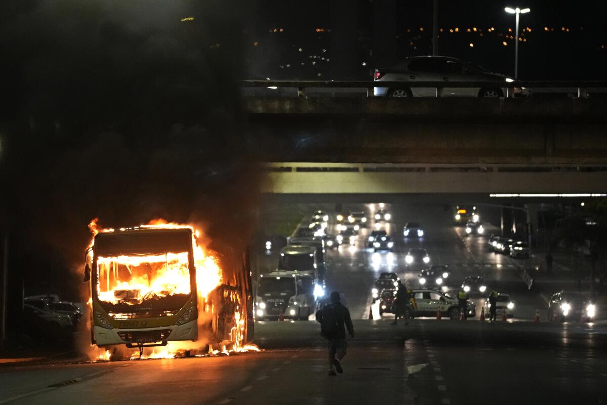 A vehicle ablaze in the dark in Brasília