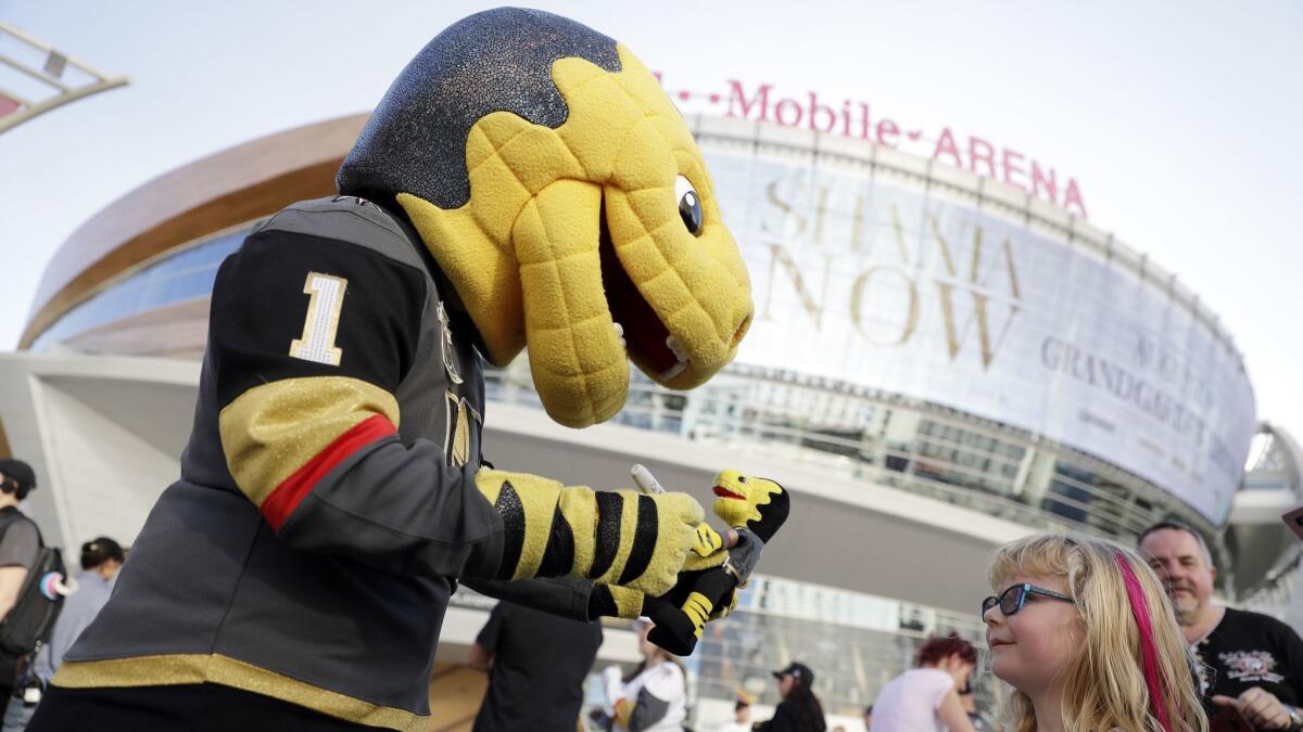 Chance, the Golden Knights mascot, greets hockey fans Saturday outside T-Mobile Arena in Las Vegas. The Knights will take on the L.A. Kings on Wednesday in the first round of the Stanley Cup playoffs.