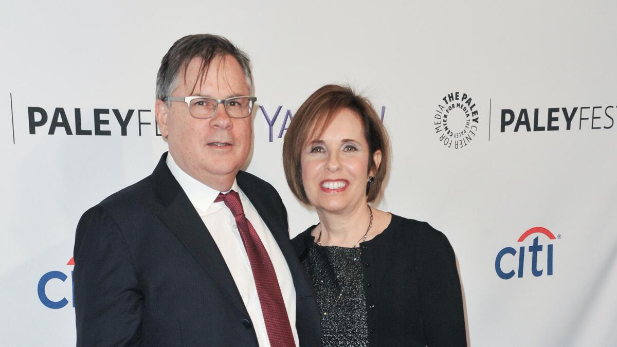 Robert King and Michelle King arrive at an event in 2015.