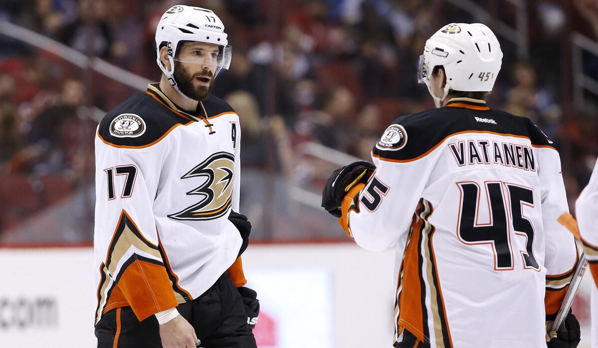 The Ducks' Ryan Kesler, left, talks with Sami Vatanen during a game against the Arizona Coyotes on March 3.