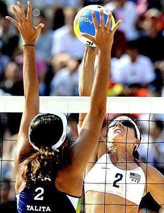 USA's Misty May-Treanor spikes a shot against Brazil's Talita Antunes during a semifinal match at the 2008 Beijing Olympics.