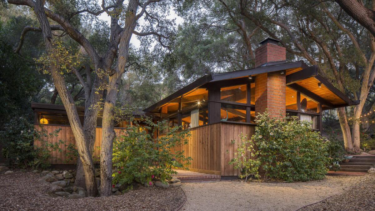 The 1970s post-and-beam, designed by Donald Rucker and recently renovated by Dan Meis, sits on more than an acre in Calabasas.