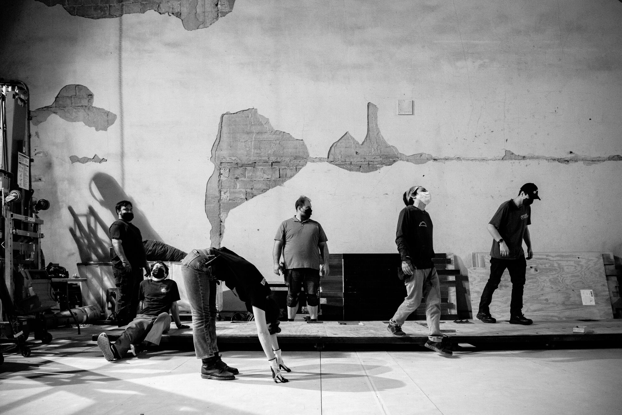 Crew members at work on a stage.