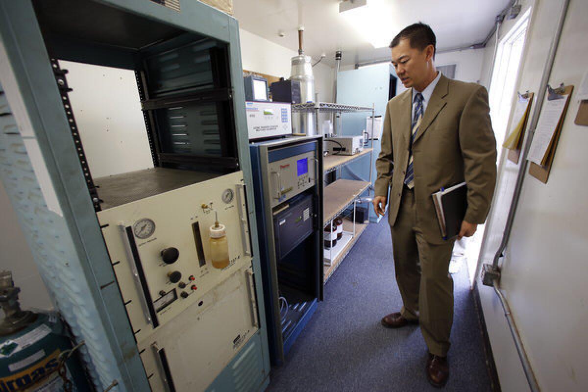 Jason Low, atmospheric measurements manager for the South Coast Air Quality Management District, at a special air monitoring station along the 710 Freeway in Long Beach.