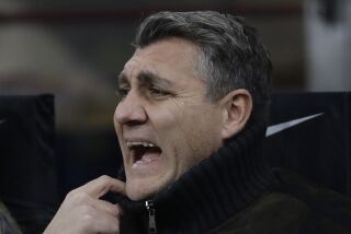 FILE - In this Dec. 6 2019 file photo, Christian Vieri, Italian former player of Inter Milan and Italy, reacts at the start of a Serie A soccer match between Inter Milan and Roma, at the San Siro stadium in Milan, Italy. Christian Vieri’s informal talk show on Instagram Live has quickly gained a devoted audience of followers during the coronavirus lockdown. On a nightly basis, Vieri calls up his old teammates scattered throughout Italy and around the world to reminisce about their time together in the late 1990s and early 2000s. Guests have included international stars like Ronaldo, Hernán Crespo and Juan Sebastián Verón; along with Italians Francesco Totti, Paolo Maldini, Filippo Inzaghi, Alessandro Nesta and Marco Materazzi.(AP Photo/Luca Bruno)
