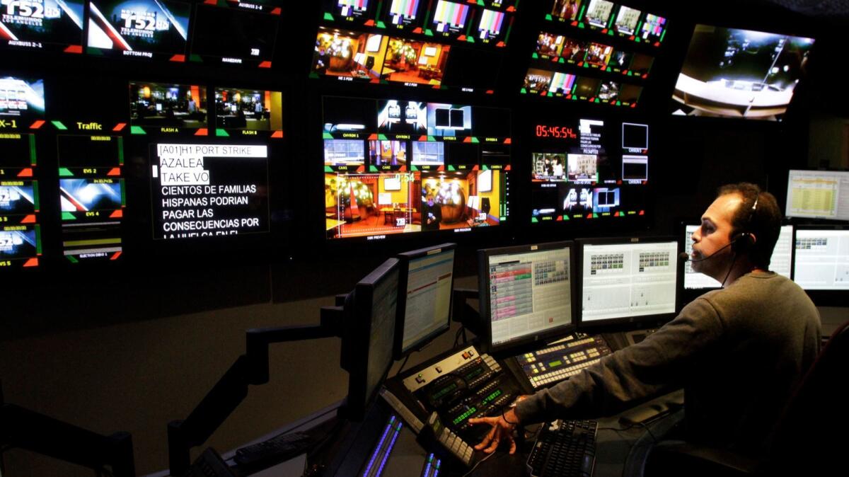 Director Niels Canelo works in the control room at Telemundo's local news station, KVEA-TV Channel 52, in Burbank.