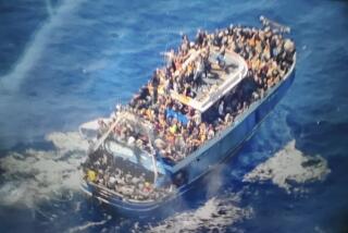 This undated handout image provided by Greece's coast guard on Wednesday, June14, 2023, shows scores of people covering practically every free stretch of deck on a battered fishing boat that later capsized and sank off southern Greece. A fishing boat carrying migrants trying to reach Europe capsized and sank off Greece on Wednesday, authorities said, leaving at least 79 dead and many more missing in one of the worst disasters of its kind this year.(Hellenic Coast Guard via AP)