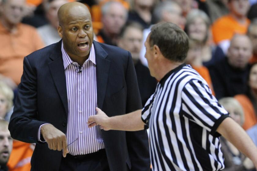 Oregon State Coach Craig Robinson argues a call during the Beavers' overtime win over USC on Thursday.