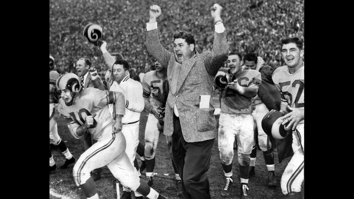 Coach Joe Stydahar and members of the Los Angeles Rams celebrate winning the National Football League Championship 24-17 over the Cleveland Browns in game at the Coliseum.