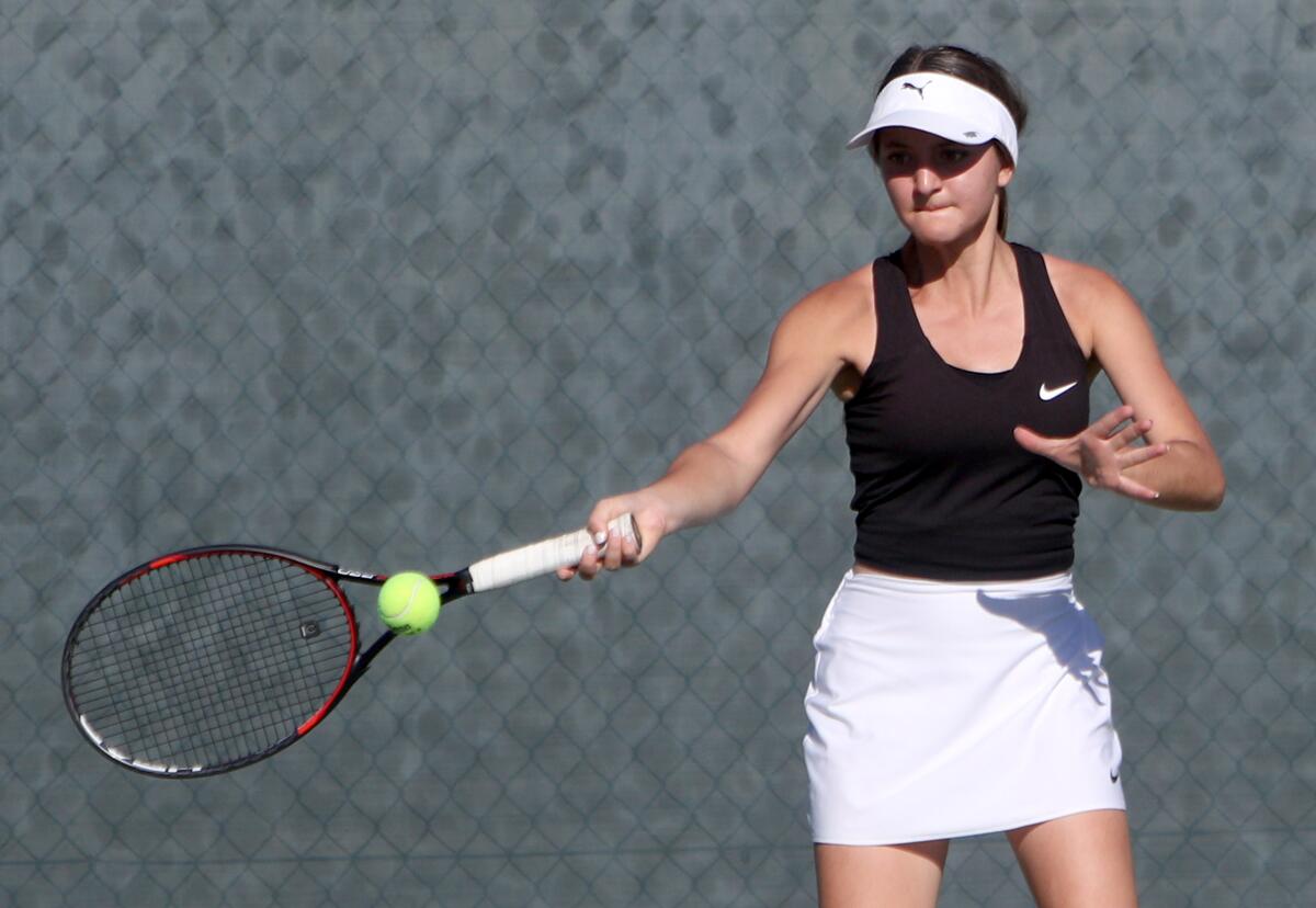 Glendale High School tennis player Ani Harutyunyan returns the ball in away game vs. Crescenta Valley High School, in La Crescenta on Tuesday, Oct. 22, 2019.