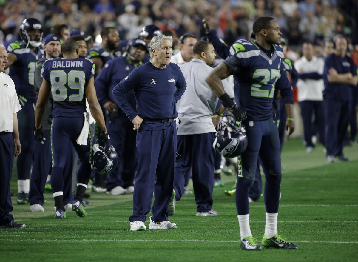 Seahawks Coach Pete Carroll reacts after quarterback Russell Wilson's pass was intercepted when Seattle elected to pass instead of run the ball in the closing seconds of Super Bowl XLIX.