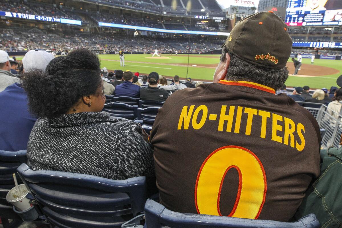Dirk Lammers, with wife Angela two years ago at Petco Park, needs to update his "No-Hitters 0" Padres jersey.