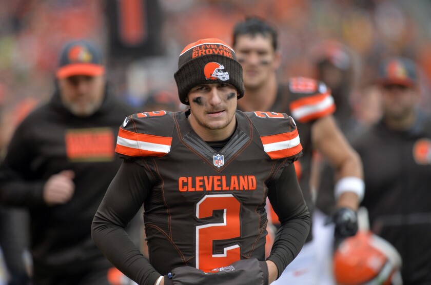 Then-Cleveland Browns quarterback Johnny Manziel walks off the field at halftime during a game against the Cincinnati Bengals on Dec. 6, 2015.