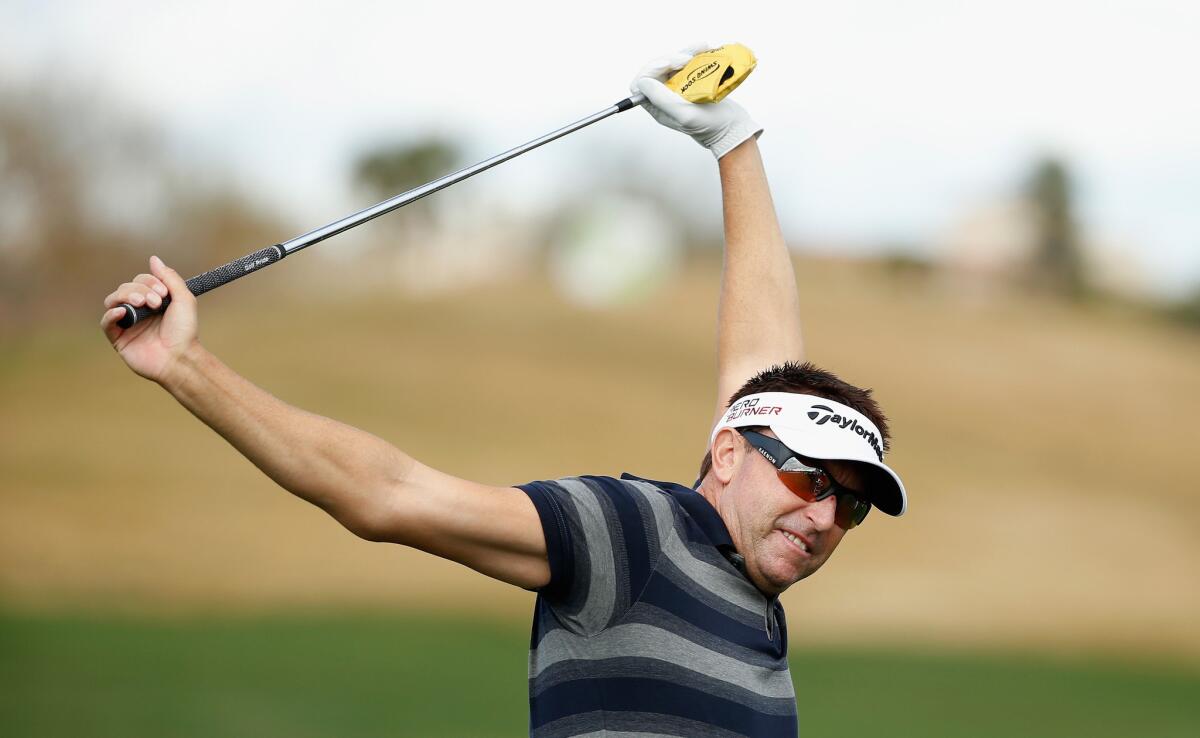 Robert Allenby loosens up before the start of the Waste Management Phoenix Open at TPC Scottsdale on Jan. 27.