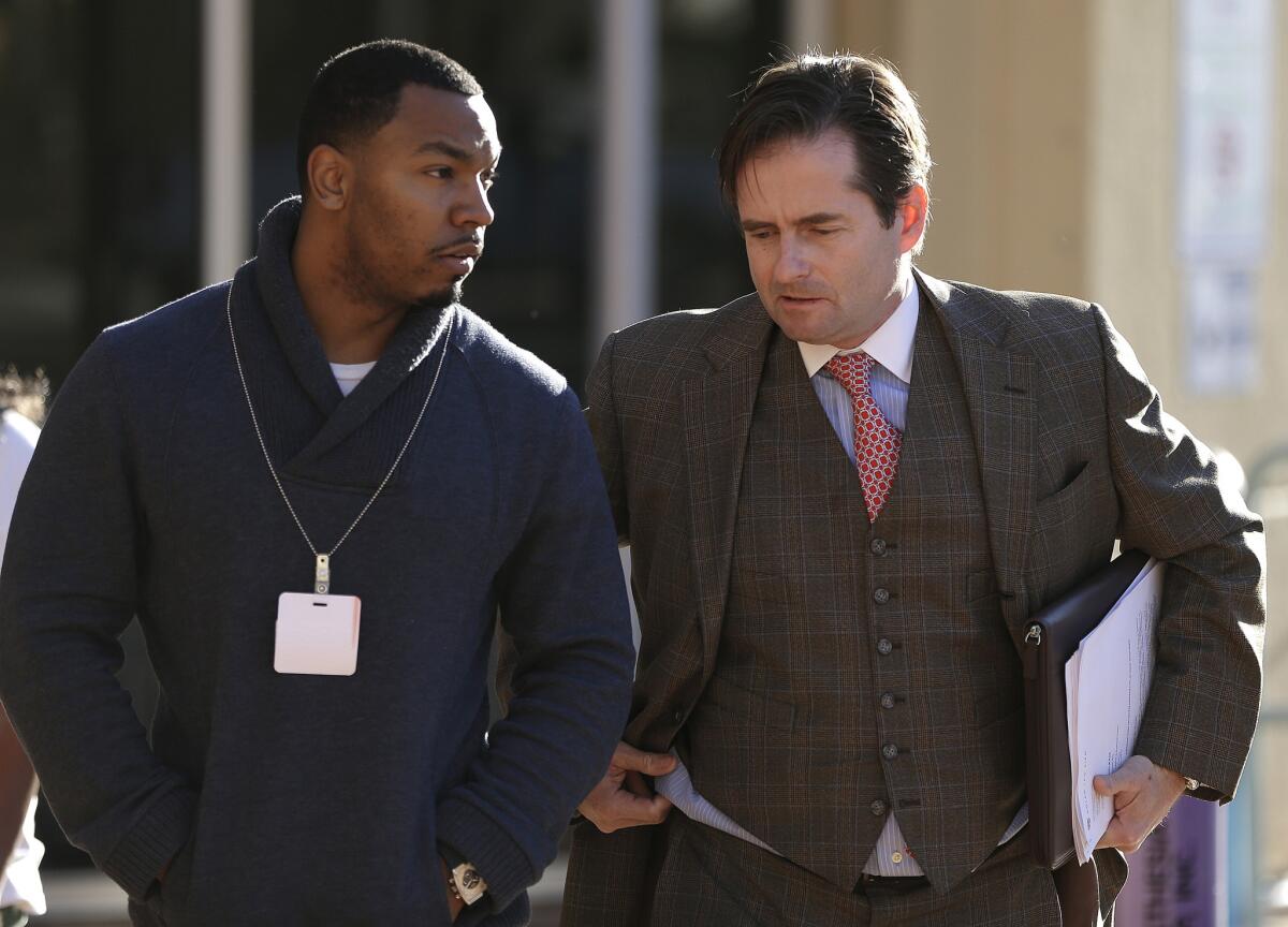 Omari Sealey, left, uncle of Jahi McMath, speaks with attorney Christopher Dolan before Thursday's news conference in front of Children's Hospital Oakland. Jahi, who has been declared brain dead, remains on life support at the hospital.