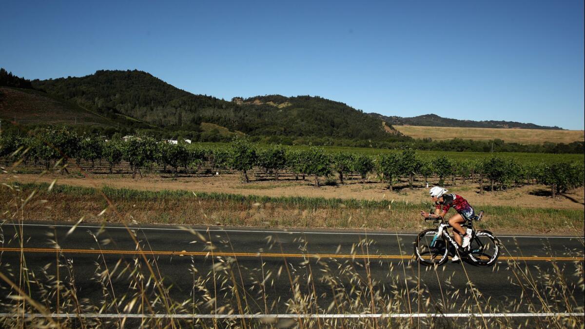 A cyclist competes in the bike part of the Ironman contest in Santa Rosa in May.