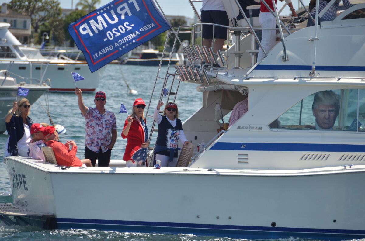 The Escape boat passengers wave to people on Balboa Island.