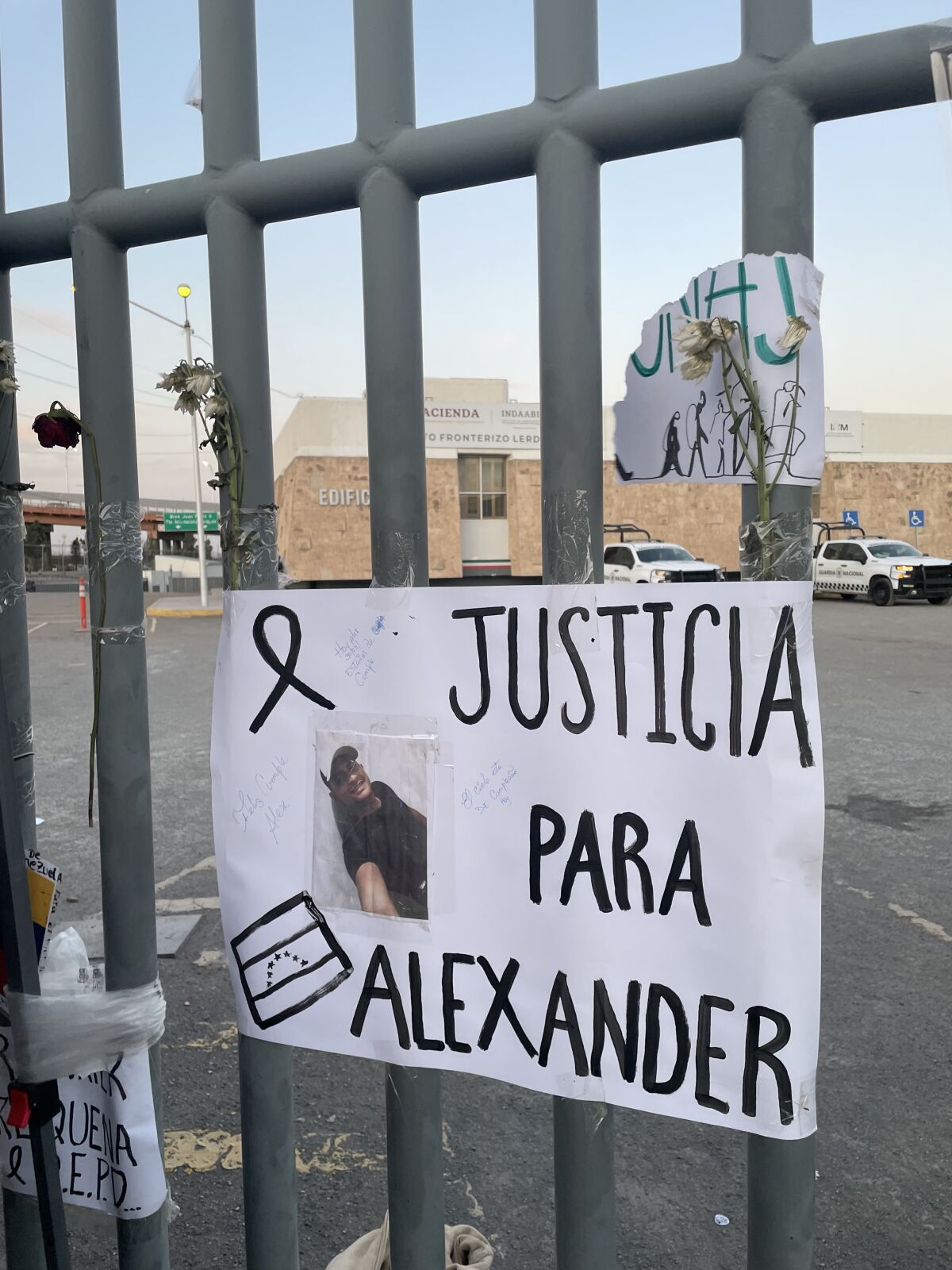 The inscription on the metal bars reads: "Justice for Alexander" 
