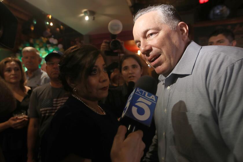 LOS ANGELES, CALIF. - JUNE 7, 2022. Los Angeles County Sheriff Alex Villanueva talks with seporters at an election night gathering in Boyle Heights on Tuesday, June 7, 2022. (Luis Sinco / Los Angeles Times)