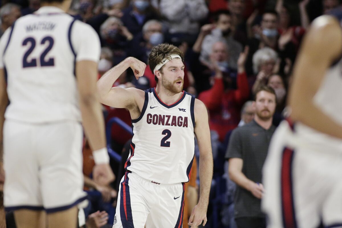 Gonzaga forward Drew Timme (2) celebrates his basket against Texas during the first half of an NCAA college basketball game Saturday, Nov. 13, 2021, in Spokane, Wash. (AP Photo/Young Kwak)
