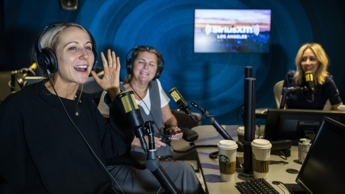 Comedian Nikki Glaser, left, records her morning radio show, 'You Up With Nikki Glaser' on Comedy Central radio at the new SiriusXM office in Los Angeles.