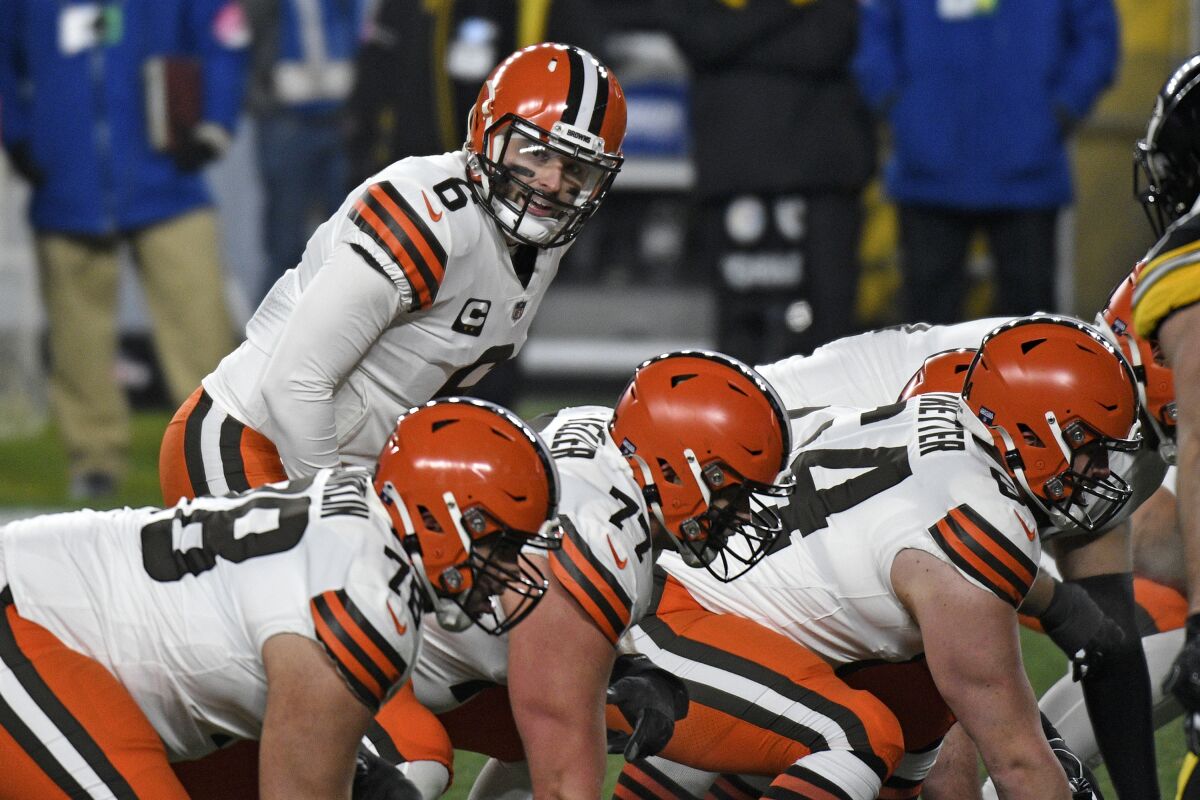 Cleveland Browns quarterback Baker Mayfield (6) lines up behind center during the first half of an NFL wild-card playoff football game against the Pittsburgh Steelers in Pittsburgh, Sunday, Jan. 10, 2021. (AP Photo/Don Wright)