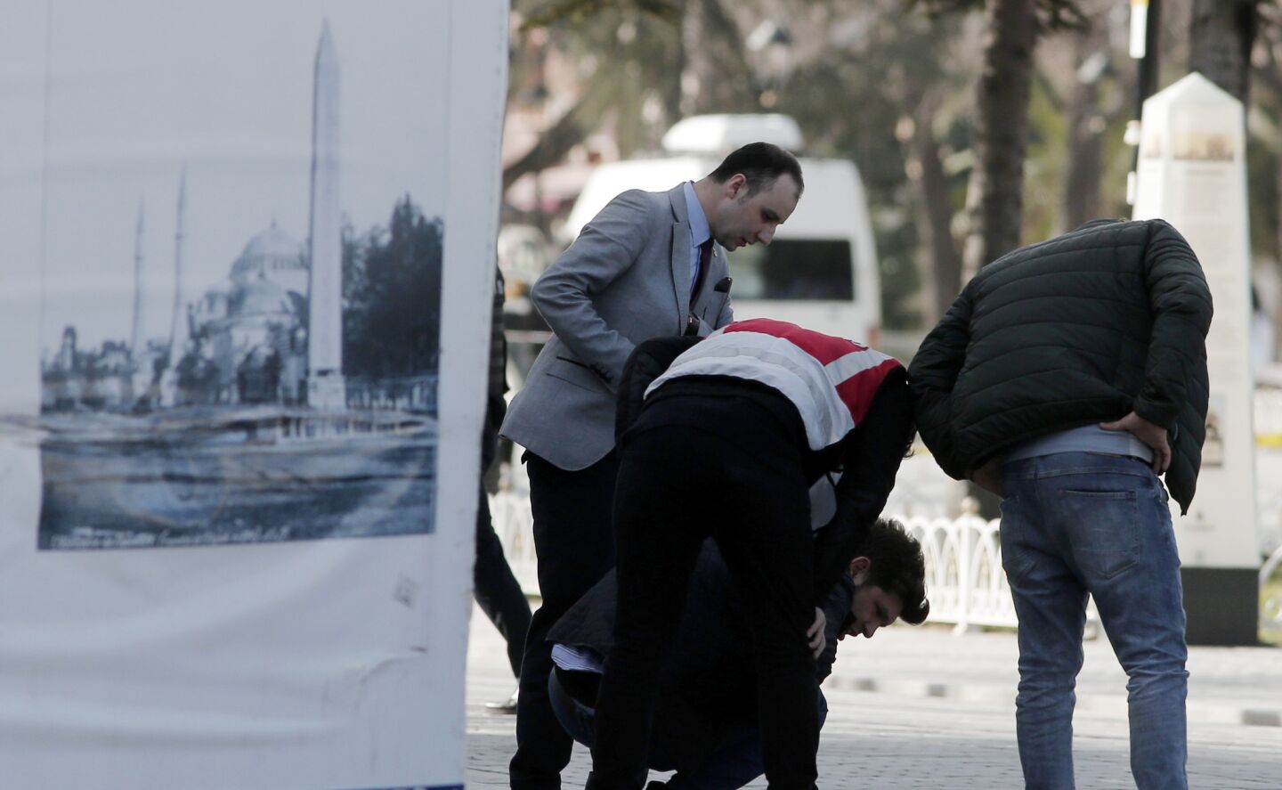 Policemen search for evidence at the historic Sultanahmet district after an explosion in Istanbul.