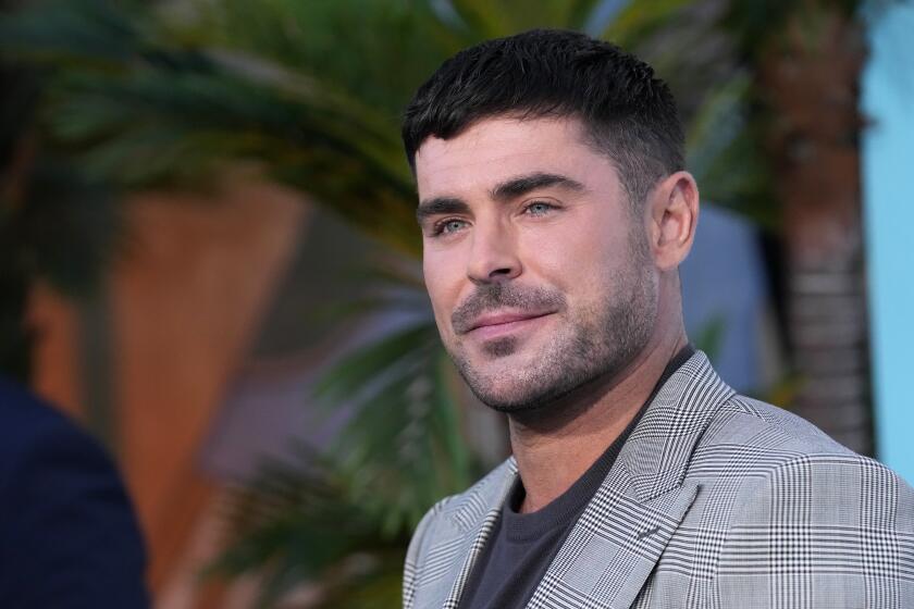 Zac Efron poses at the premiere of the Netflix film "A Family Affair" at the Egyptian Theatre, Thursday, July 13, 2024, in Los Angeles. (AP Photo/Chris Pizzello)