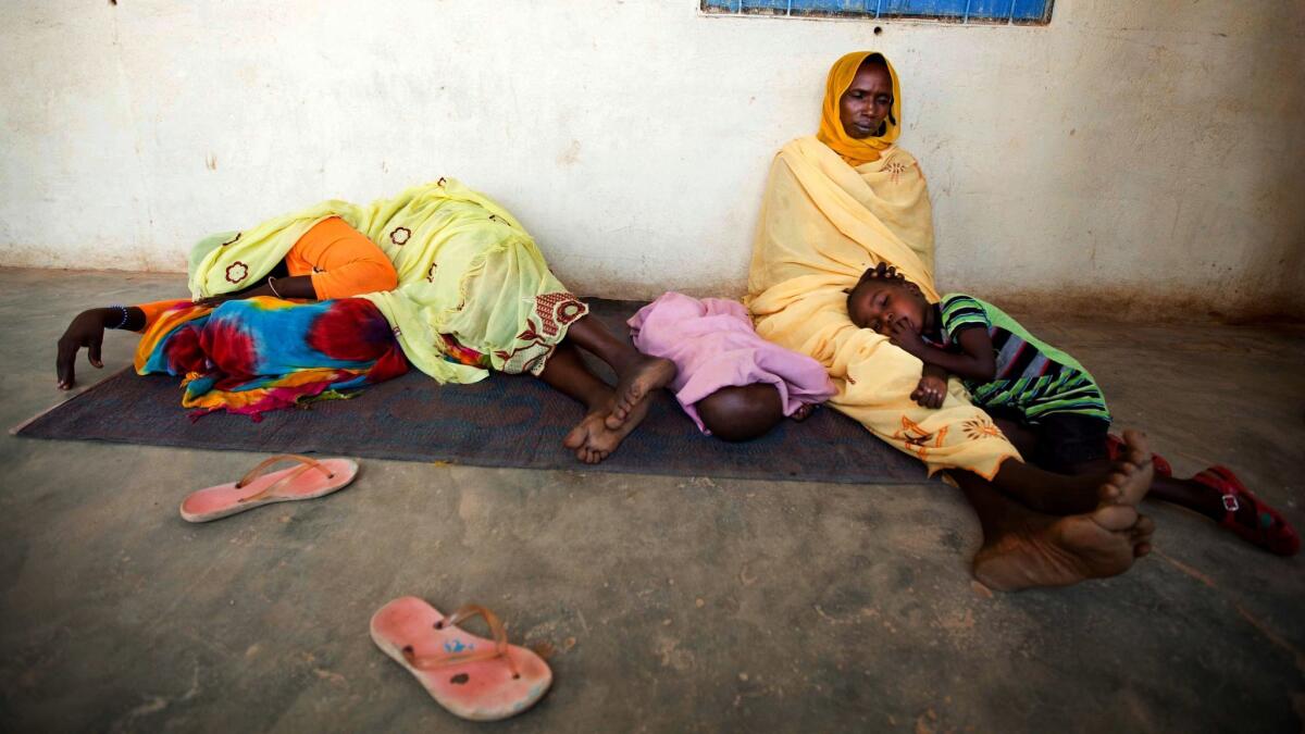 People await treatment at a hospital in North Darfur, Sudan, in 2013. Efforts to curb malaria are off track, partly due to poor health systems in some countries and a stagnation in funding to combat the disease, according to the World Health Organization.