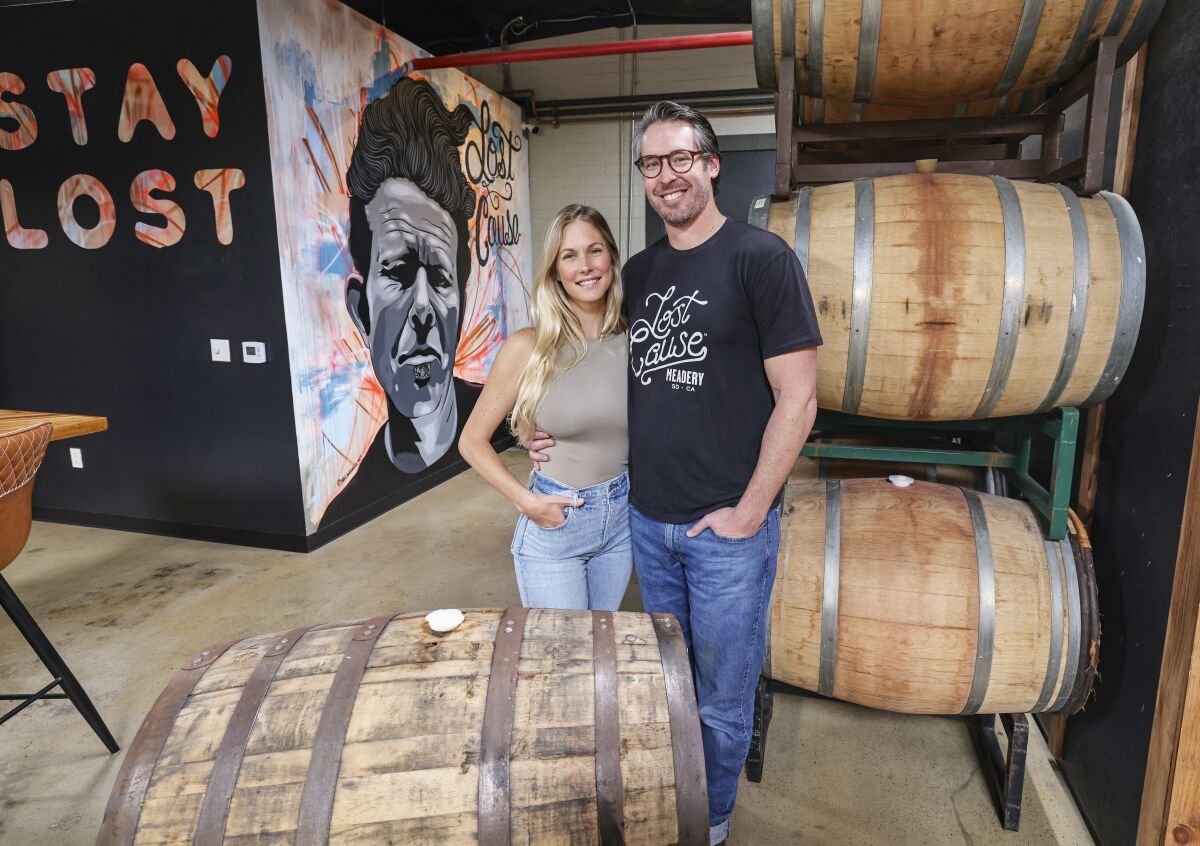 Lost Cause Meadery owners Suzanna Betz and Billy Betz inside the barrel room of their San Diego business on March 9.