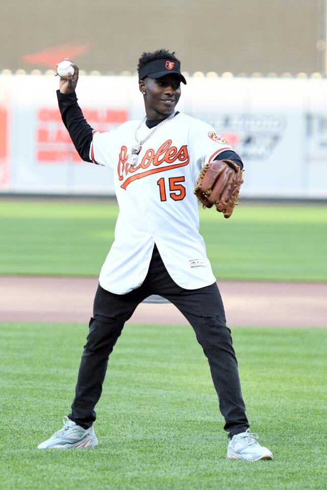Ravens first-round draft pick Marquise Brown throws out the first pitch before a game between the Baltimore Orioles and the Boston Red Sox at Oriole Park at Camden Yards on May 6, 2019.