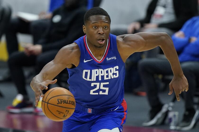 Los Angeles Clippers' Mfiondu Kabengele drives in the second half of an NBA basketball game against the Cleveland Cavaliers, Wednesday, Feb. 3, 2021, in Cleveland. (AP Photo/Tony Dejak)