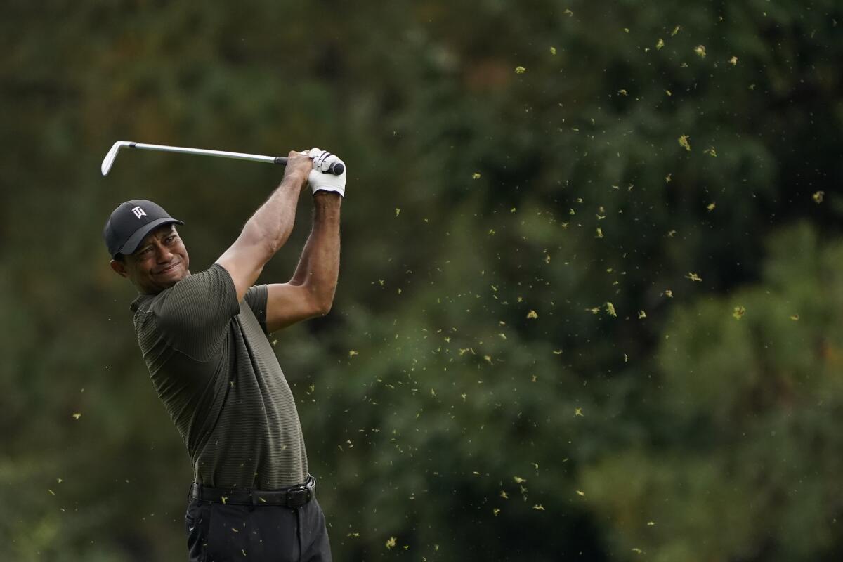 Tiger Woods hits on the 15th fairway during the first round of the Masters on Thursday in Augusta, Ga.