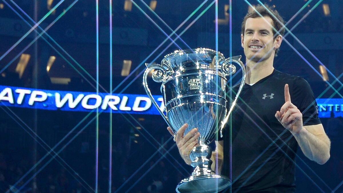 Andy Murray poses with the ATP trophy after winning the men's singles final against Serbia's Novak Djokovic on Sunday.