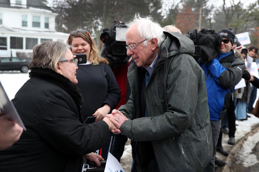 MANCHESTER, NEW HAMPSHIRE - FEBRUARY 11: Democratic presidential candidate Sen. Bernie Sanders (I-VT) greets people campaigning for him outside of a polling station on February 11, 2020 in Manchester, New Hampshire. Mr. Sanders awaits the results of the votes for the first-in-the-nation New Hampshire primary. (Photo by Joe Raedle/Getty Images) ** OUTS - ELSENT, FPG, CM - OUTS * NM, PH, VA if sourced by CT, LA or MoD **
