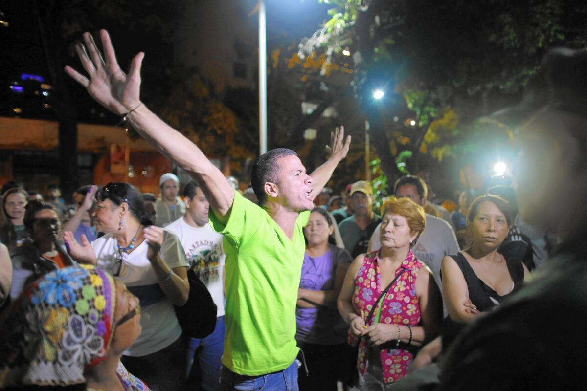 Opposition supporters celebrate the closing of a polling station in Caracas, Venezuela.