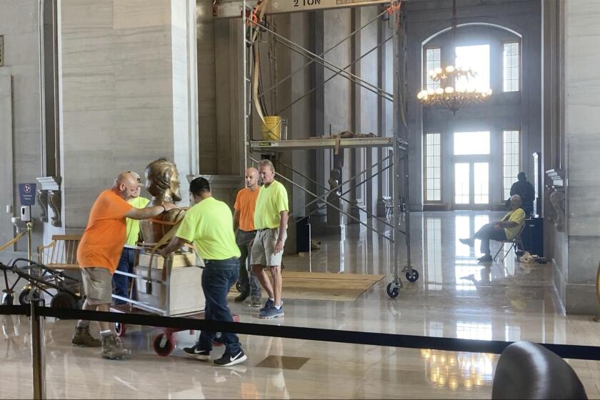The Nathan Bedford Forrest bust is removed from inside of the Tennessee Capitol on Friday, July 23, 2021 in Nashville. Tennessee’s State Building Commission voted 5-2 to remove the bust of the Confederate general and early Ku Klux Klan leader on Thursday, the final hurdle in a months-long process. (AP Photo/Kim Kruesi)