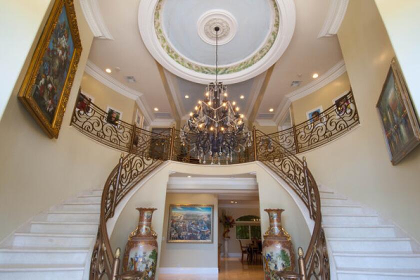 Brad Turell's home features a grand foyer with dual staircases and 35-foot-tall ceilings.