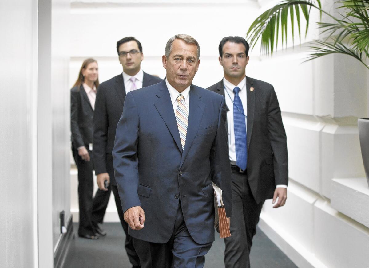 House Speaker John Boehner is seen Tuesday arriving for a meeting of the Republican Conference on Capitol Hill in Washington.