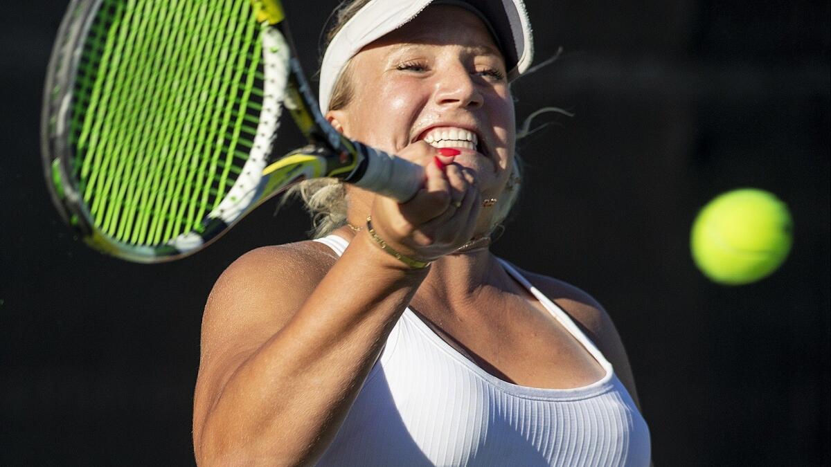 Corona del Mar High's Kristina Evloeva returns a shot against University during a nonleague match on Tuesday. She went 2-1 in singles play.