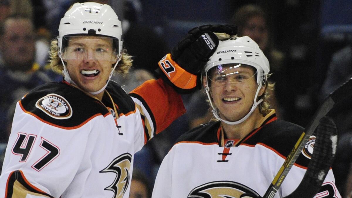 Ducks center William Karlsson, right, celebrates with defenseman Hampus Lindholm after scoring in the second period of a 5-1 win over the Buffalo Sabres on Monday.