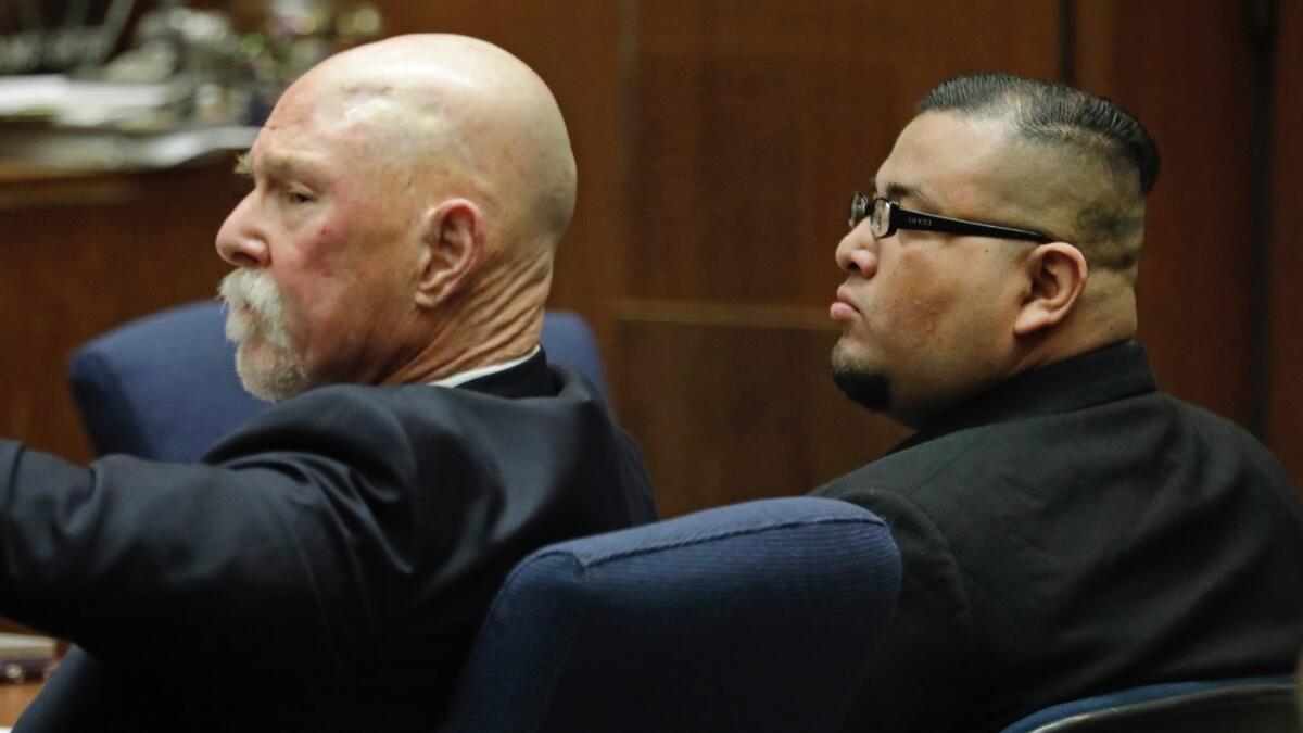 Jorge Palacios, right, sits with lawyer Lawrence Forbes during closing arguments in his trial. Palacios was found guilty of killing Jacqueline Piazza in 2001.